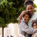 Birthmother plays with children